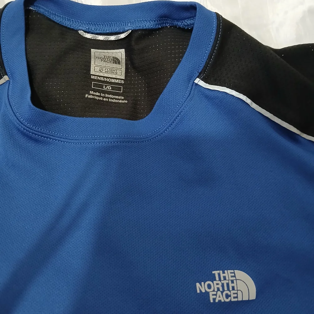 The North Face Blue and Black Athletic Shirt